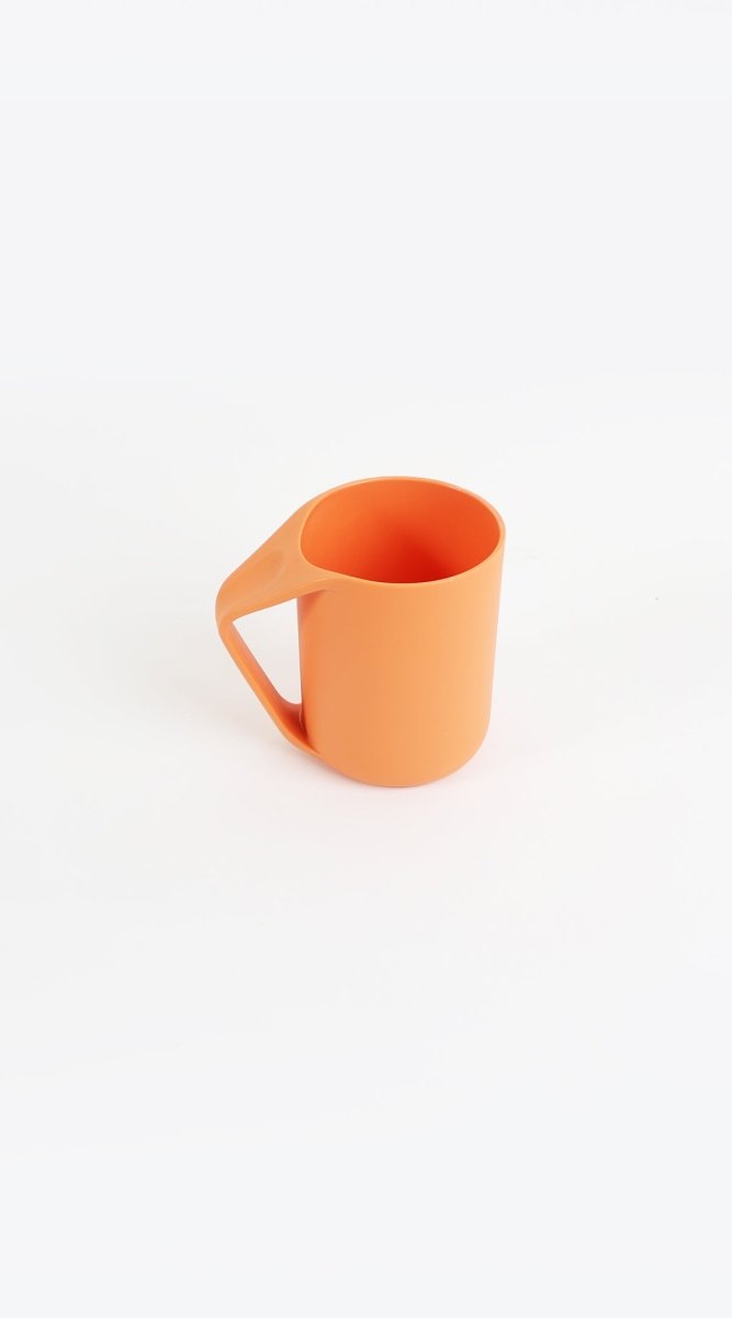 Orange plastic cup with handle, open top, curved spout
