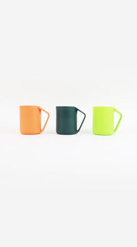 Three plastic cups: orange, dark green, light green, each with handle