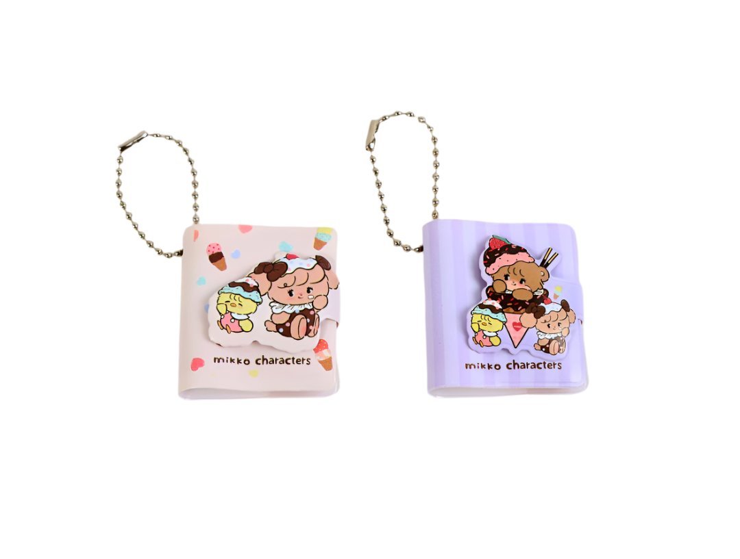 Small character keychain bookholder pair: pink and purple PU with cute cartoon art.