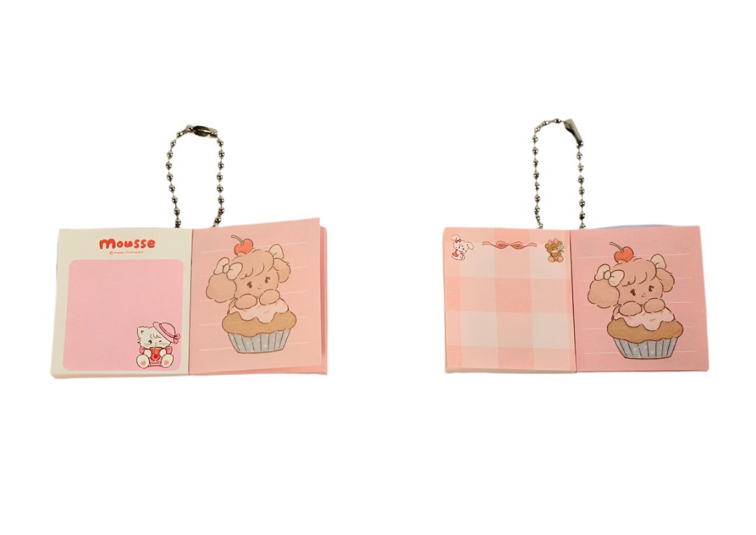 Small character keychain bookholders with pink panels and cartoon bear cupcake art.