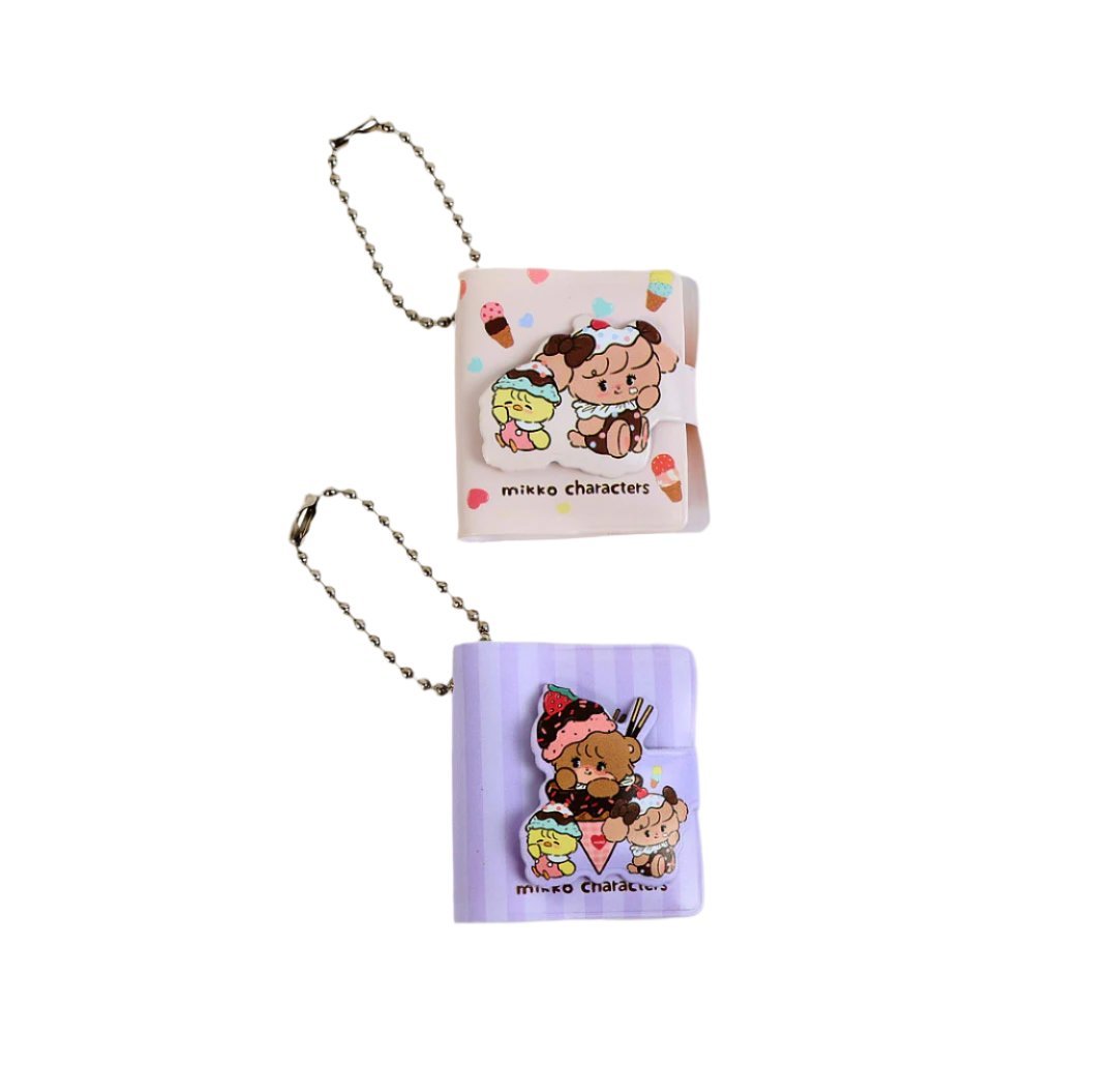 Small character keychain bookholder set: pink square and purple roll with cartoon characters.