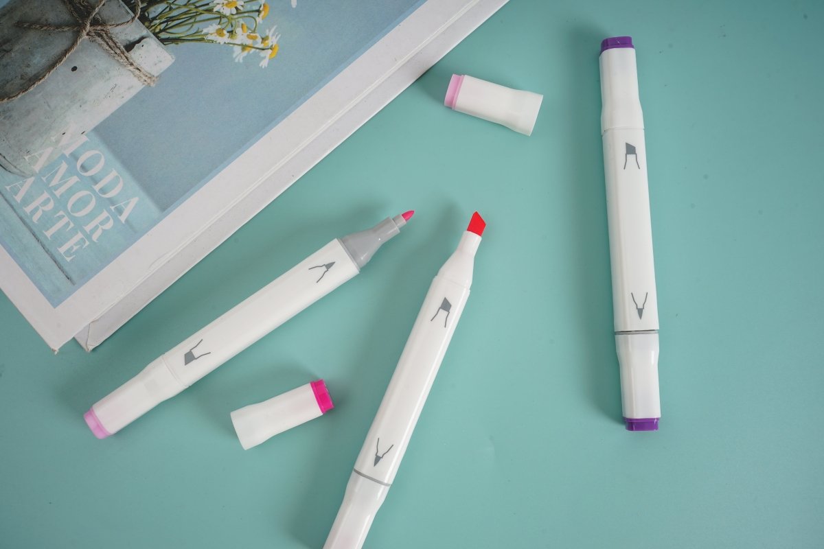 Purple highlighters set with some caps off, showing marker tips