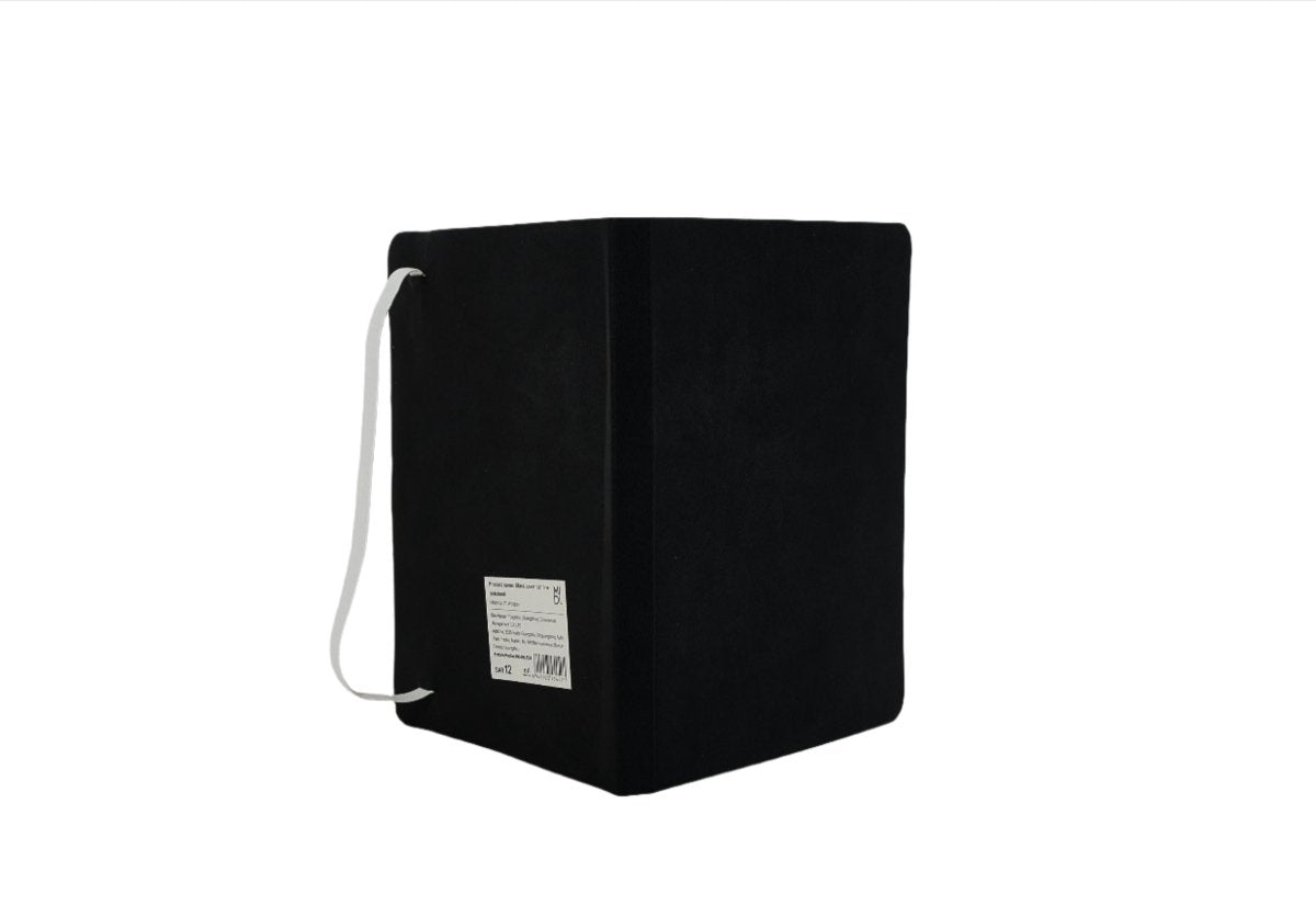 Black compact notebook with ribbon bookmark and stitched binding