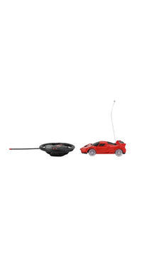 RC racing car set with small red car and black steering wheel controller