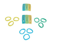 Colorful kids hair clips in yellow, light blue, and teal, shown without packaging