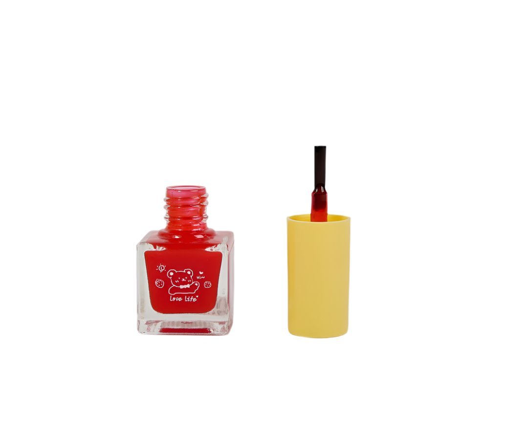 Red nail polish bottle with cute bear label, yellow cap removed, square glass base