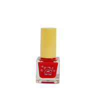 Red nail polish bottle with yellow cap and cute bear graphic on front