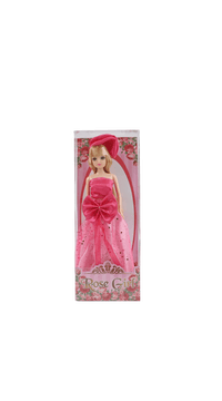 Fashion doll in window box wearing pink dress with bow