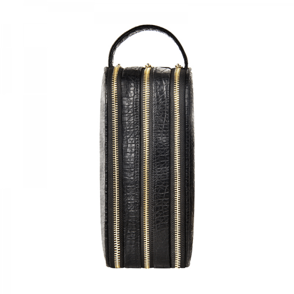 Dark faux leather 3-compartment travel case with three vertical sections and gold zippers