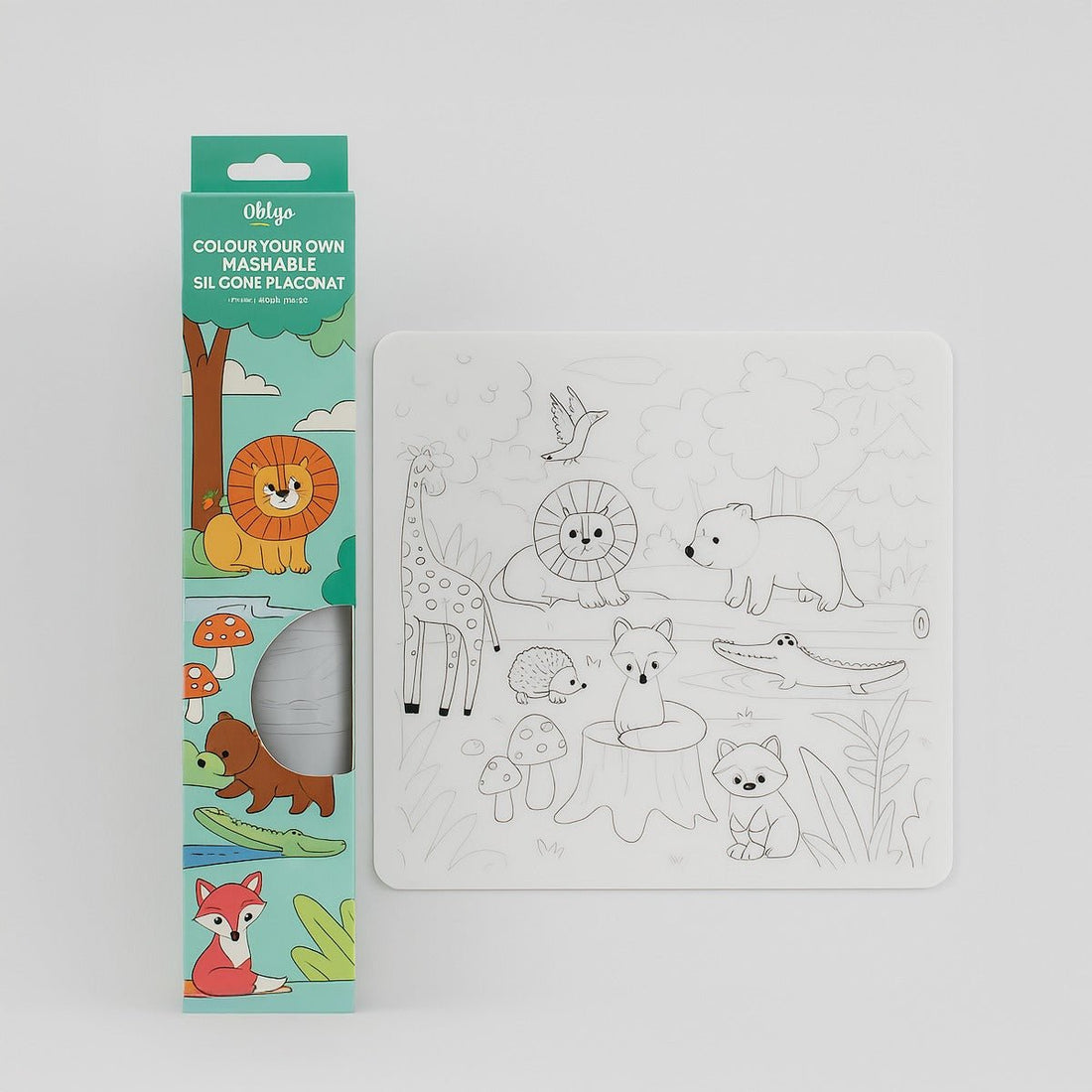 Washable silicone placemat in green-themed box with animal line-art pattern
