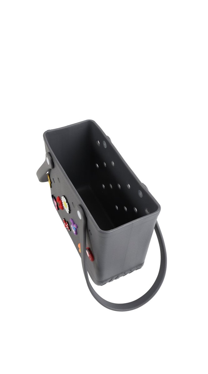 Dark gray silicone shower caddy with perforated interior and hanging loop handle