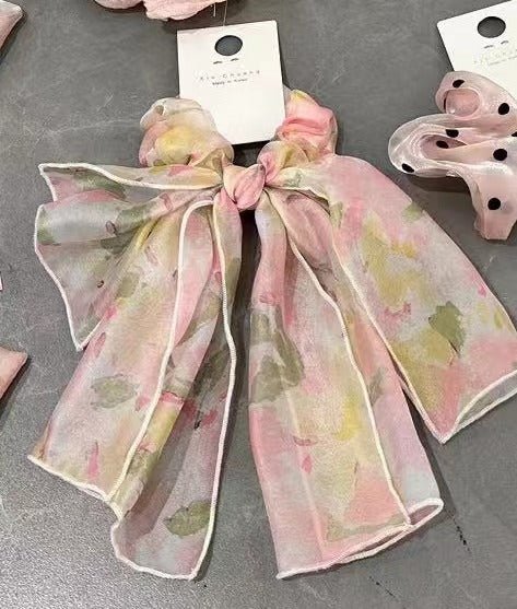 Chiffon bow hair tie with pastel pink, green, and white patterned chiffon tails