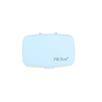 Six-cell pill organizer box with closed lid, light blue exterior