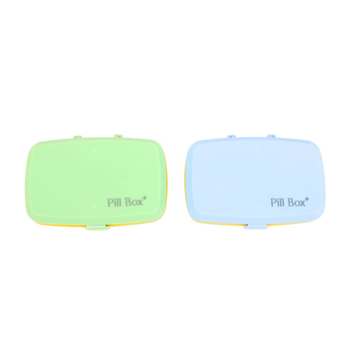 Six-cell pill organizer boxes, closed lids in green and light blue