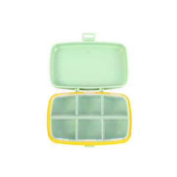 Six-cell pill organizer box with lid open, light green interior compartments