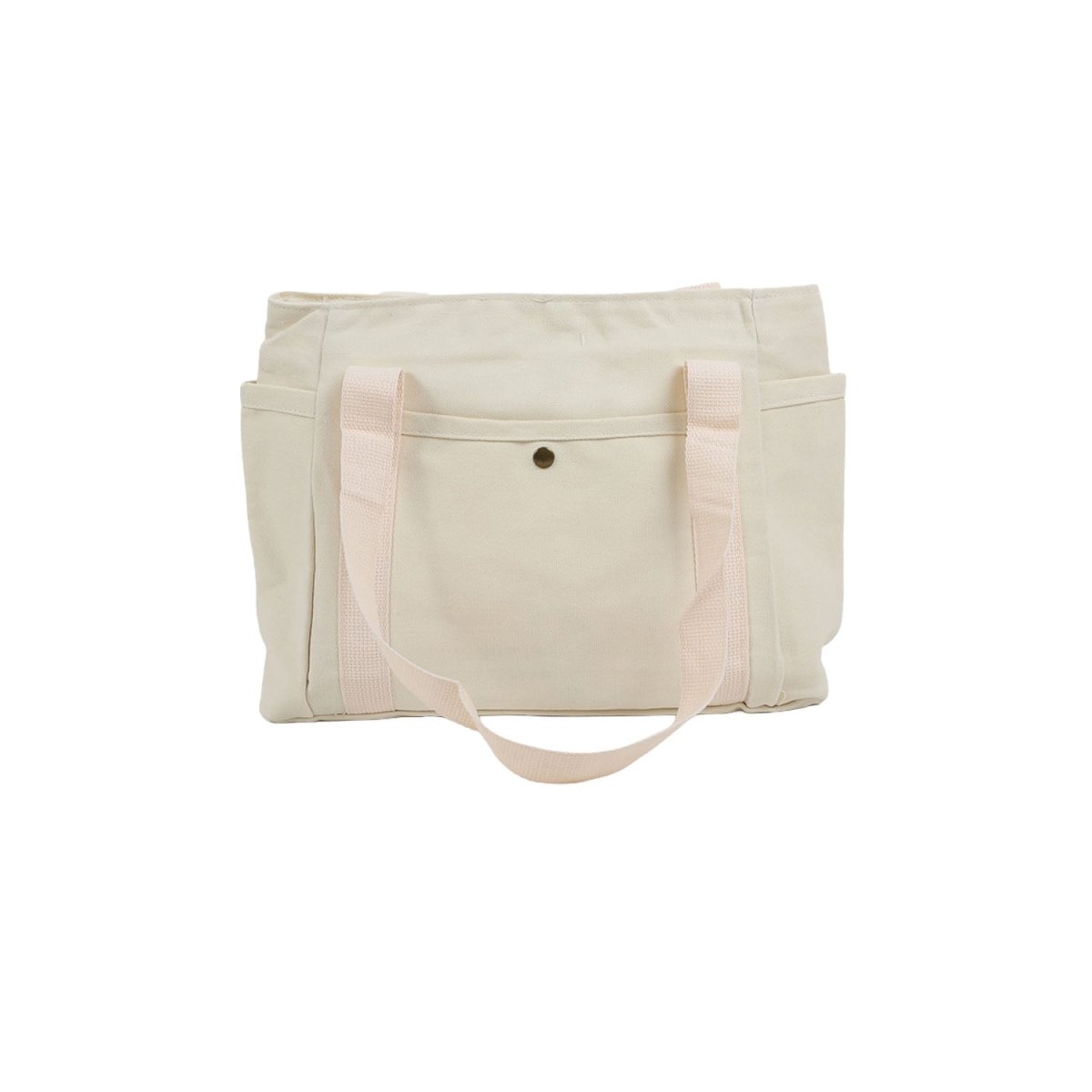 Light canvas tote bag with wide front pocket, long handles, and snap button closure.