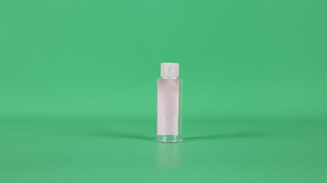 Small empty plastic bottle, clear with white screw cap