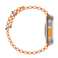 Orange perforated watch band with partial silver case edge