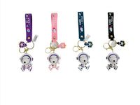 Astronaut Snoopy keychains in four colors with helmet charms and gold rings