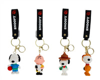 Assorted PVC Snoopy keychains with black 'SNOOPY' straps and different character charms
