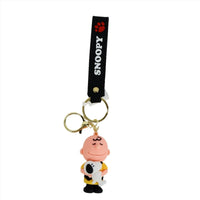 PVC keychain with black SNOOPY strap and gold rings featuring orange-haired character