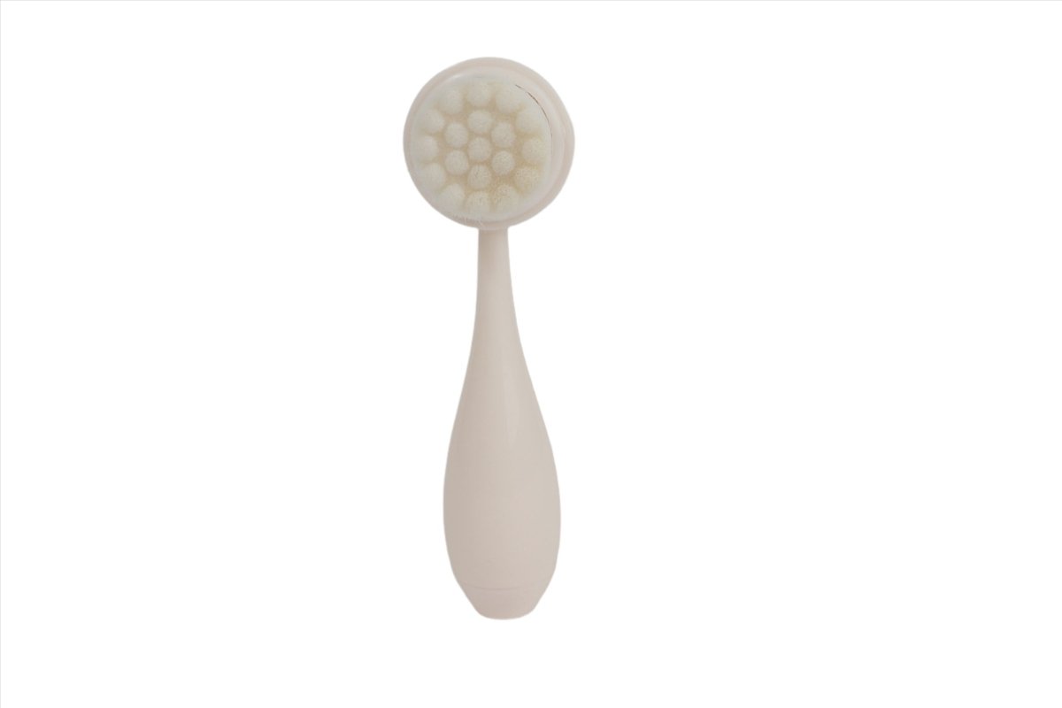 Cream face cleansing brush with soft round bristles and teardrop handle