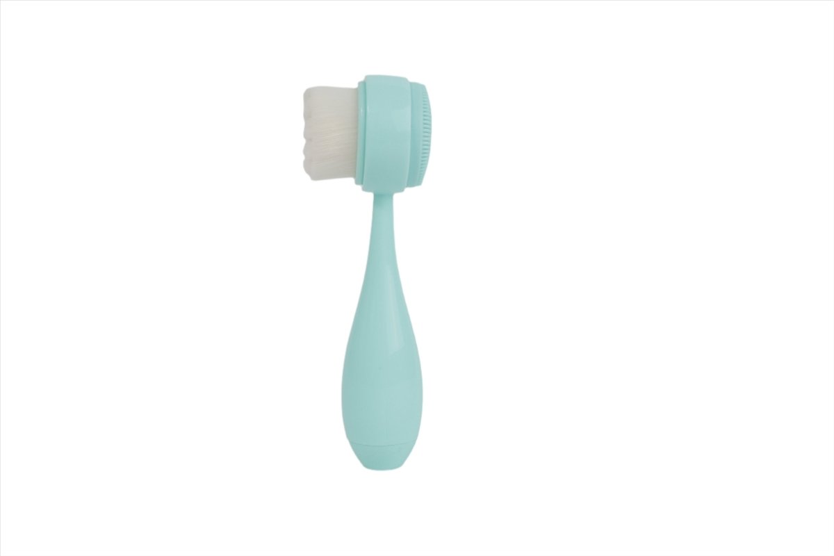 Mint face cleansing brush with square bristle pad on rectangular head and curved handle