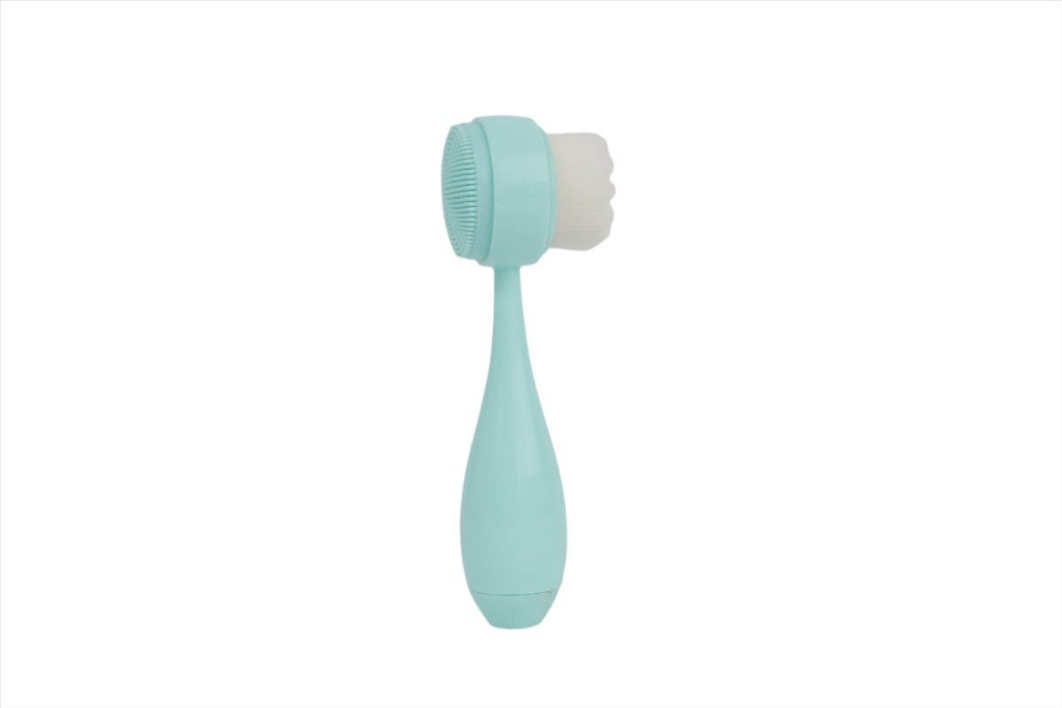 Teal face cleansing brush with textured bristle head and teardrop handle