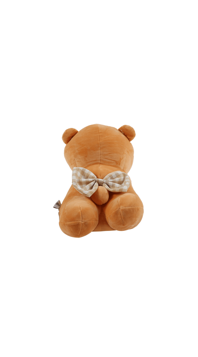 Brown plush bear pillow back view with bow tie at neck and stitched limbs