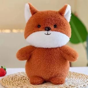 Rust-orange plush fox toy with white muzzle and chest, sitting upright