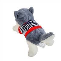 Plush husky puppy toy with gray fur, striped shirt and red collar, white paw tag