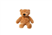 Plush teddy bear in tan-brown with black nose and button eyes, sitting pose