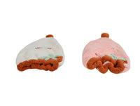 Strawberry-shaped princess hats from back: white and pink with brown ruffled hem and STRAWBERRY