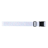 Light blue star print luggage strap with black buckle and adjustment bar at end