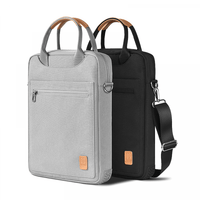 13-inch laptop bag set in light and dark gray with zip front pocket and top handle