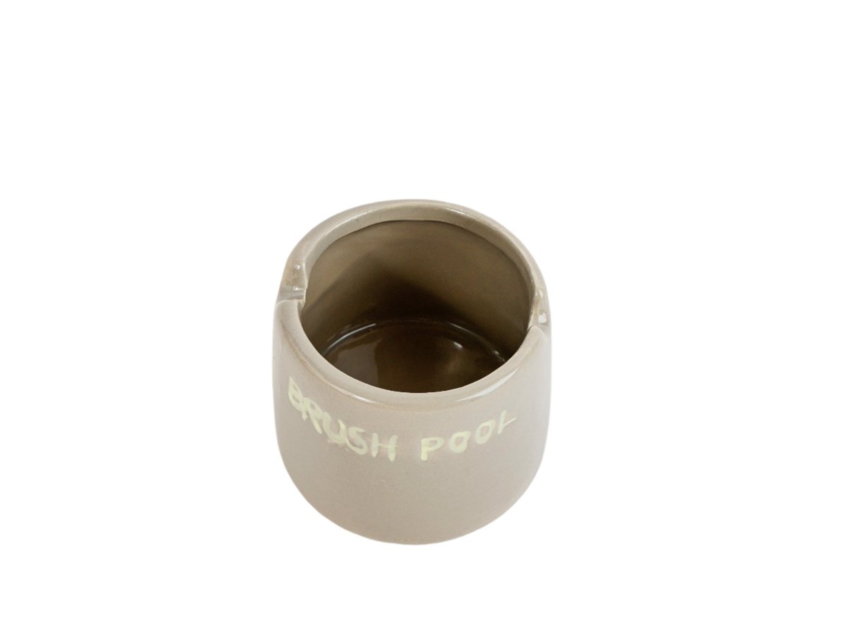 Ceramic toothbrush holder, light beige cup with open top and printed label
