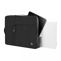 Laptop sleeve with zipper pocket, open top, and adjustable hand strap; dark fabric.