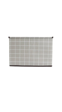 Fabric storage box with gray grid fabric, dark top trim, and button-style handle tab