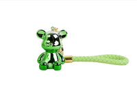 Green bear keychain with braided strap, gold clasp and curved key ring