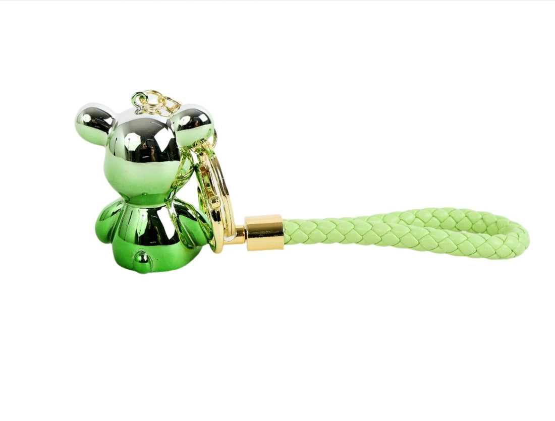Green bear keychain with braided strap, gold clasp and key ring at side