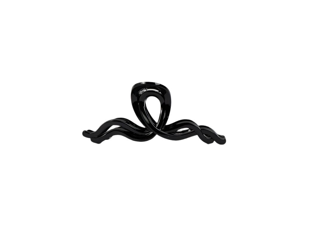 Black plastic hair clip with looped bow design and curled ends