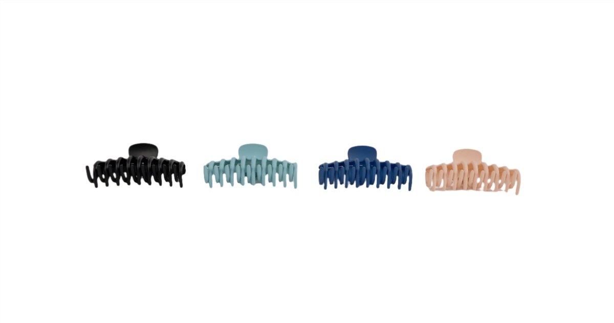Four claw hair clips in black, light teal, navy blue, and light tan