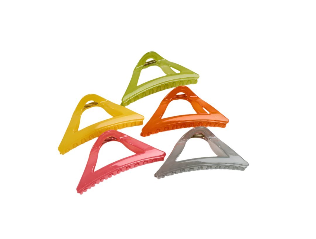 Yellow triangle plastic hair clip with cutout pattern, part of a multi-clip set