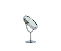 Makeup mirror with round chrome frame on round pedestal base