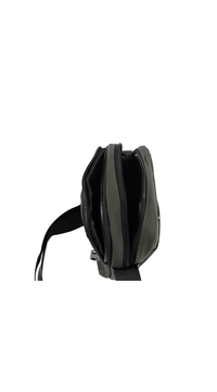 Olive crossbody bag side view with dual zippers and structured, compact body