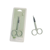 Eyebrow scissors in blister packaging, silver pointed tips and round gray finger rings