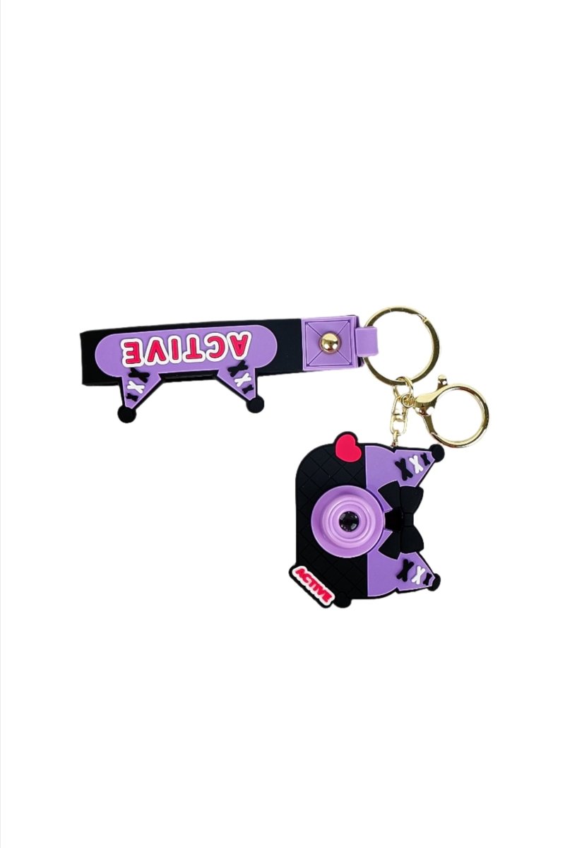 Purple camera keychain with two charms, gold rings, and black strap