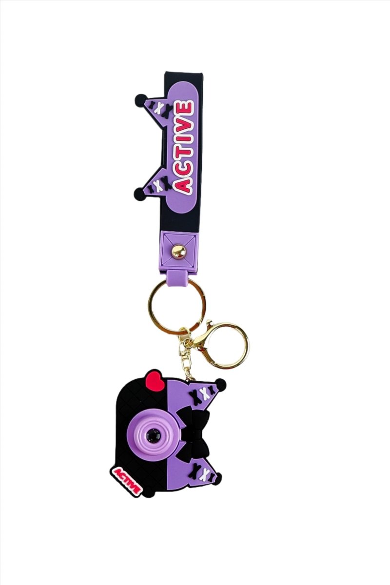 Purple strap keychain with camera charm, gold rings, and standing cat silhouette