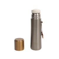 Thermal water bottle and separate gold lid cap for top