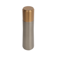 Insulated water bottle with gold screw-on lid, stainless finish